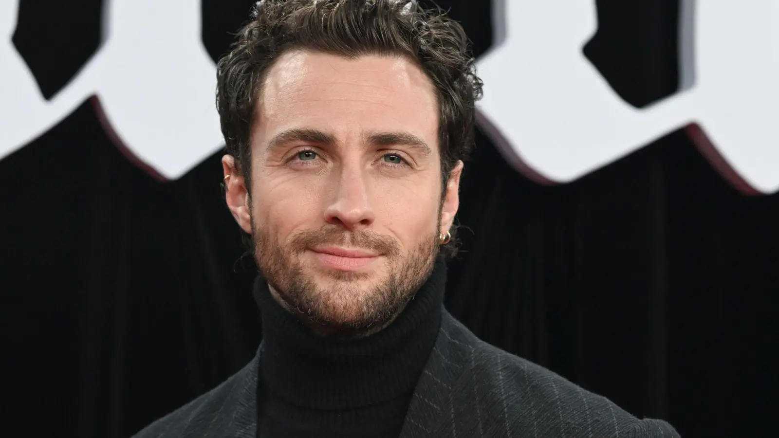 Bei der Suche nach einem neuen James-Bond-Darsteller gilt Aaron Taylor-Johnson als heißer Kandidat. (Archivbild) (Bild: Jens Kalaene/dpa)